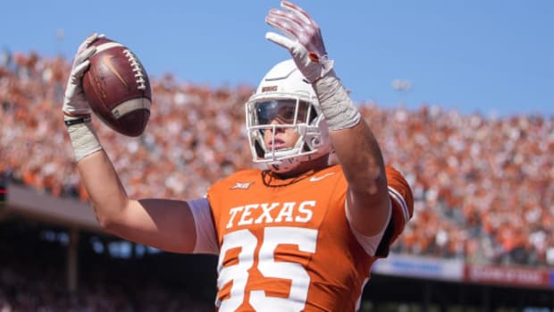 Texas Longhorns tight end Gunnar Helm celebrates a touchdown during a college football game.
